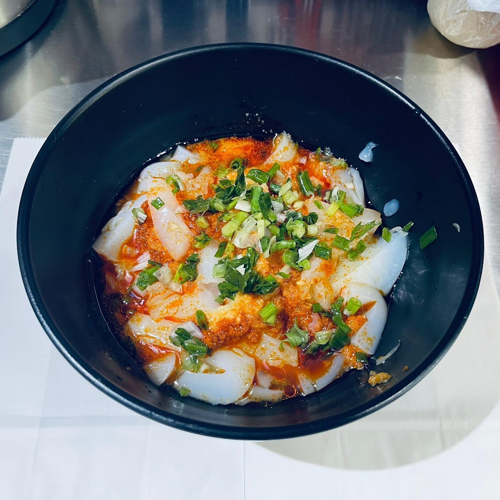 Spicy bowl of food on a black bowl in the kitchen